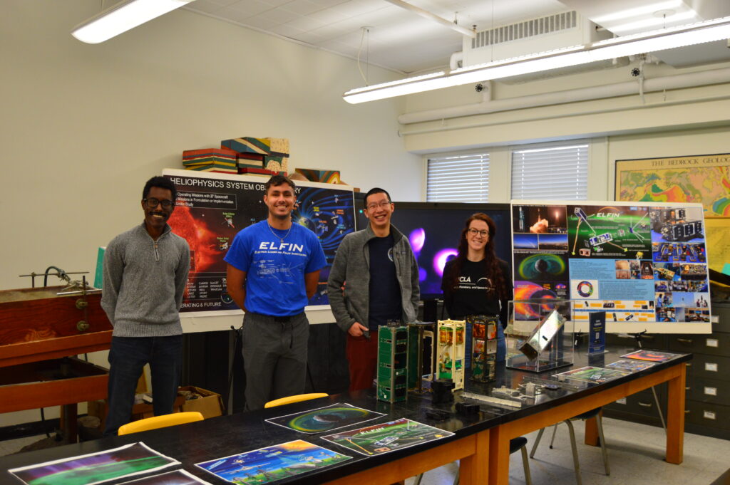 EPSS volunteers in front of their colorful space weather booth during an outreach event with K-12 students through Charles Drew University.